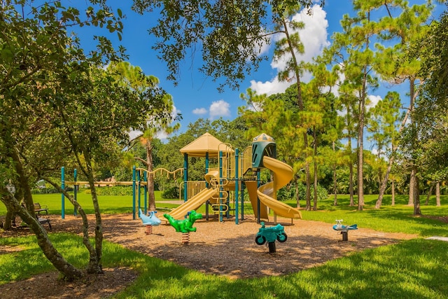 view of jungle gym featuring a lawn