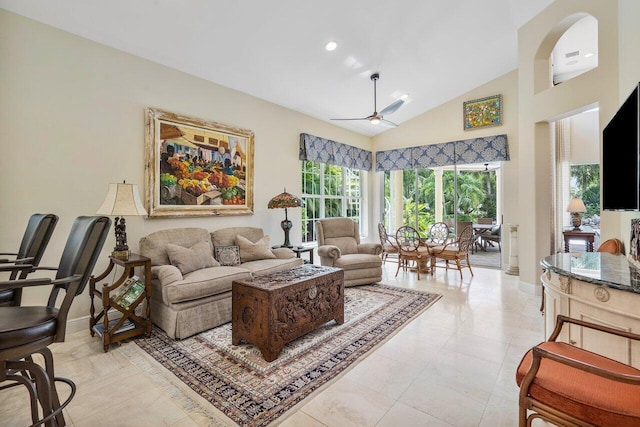 living room with light tile flooring, ceiling fan, and high vaulted ceiling