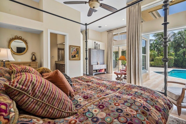 bedroom featuring hardwood / wood-style floors, ceiling fan, access to outside, and ensuite bathroom