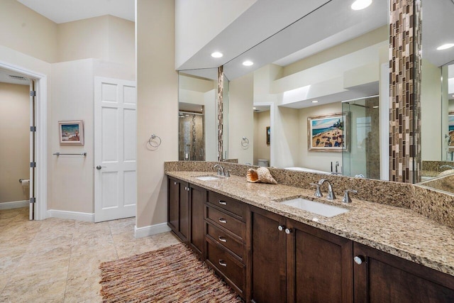 bathroom with dual vanity and tile flooring