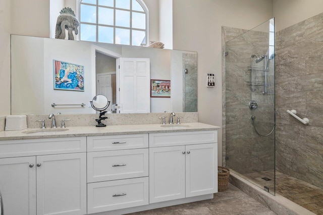 bathroom featuring an enclosed shower, tile floors, and dual bowl vanity