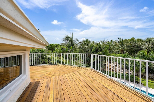 wooden deck featuring a pool