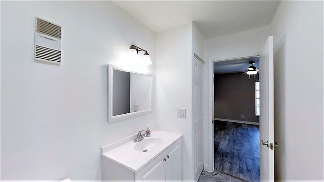 bathroom featuring ceiling fan and vanity