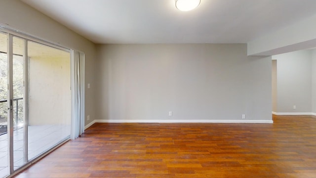 unfurnished room with hardwood / wood-style flooring