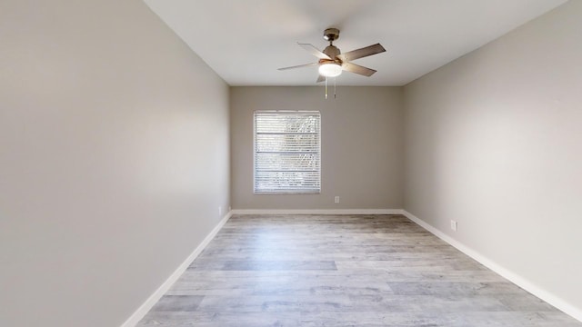 empty room featuring light hardwood / wood-style flooring and ceiling fan