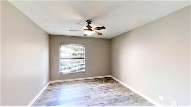 unfurnished room with ceiling fan and light hardwood / wood-style flooring