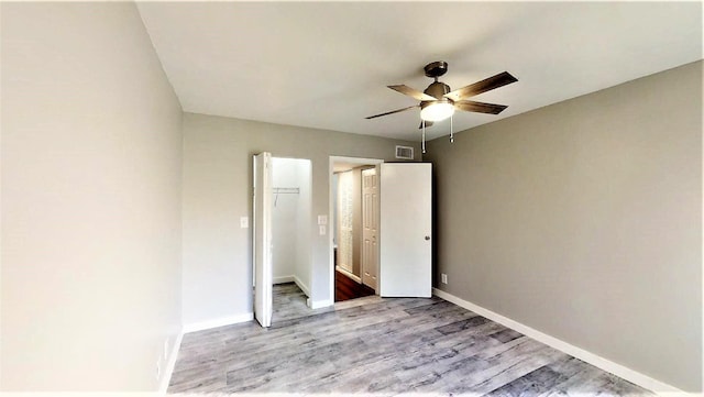 unfurnished bedroom with a closet, ceiling fan, and light hardwood / wood-style flooring