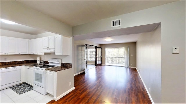 kitchen featuring white cabinetry, white appliances, sink, and hardwood / wood-style floors