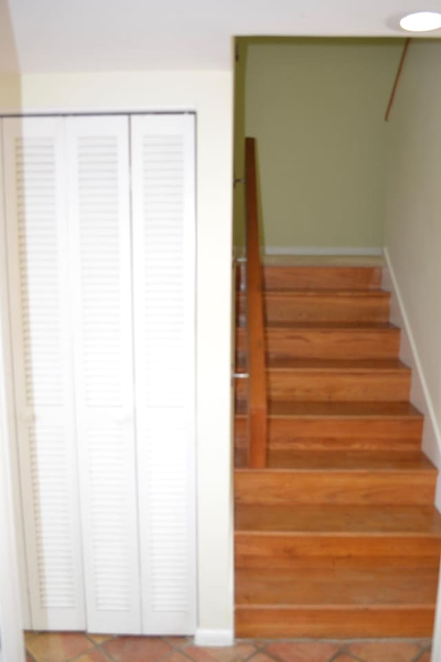 stairs featuring tile patterned floors