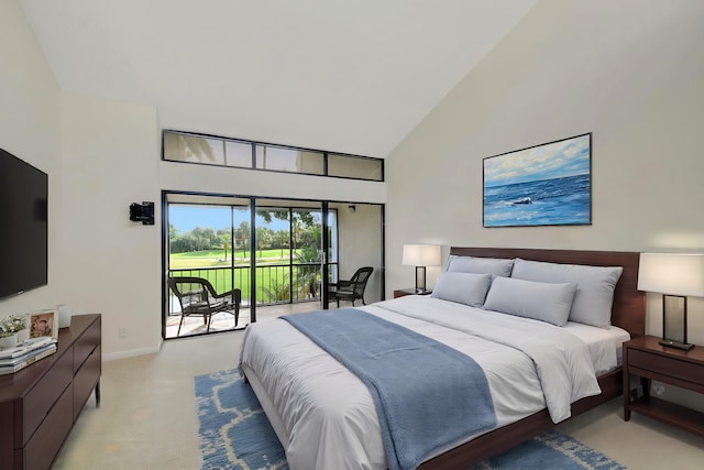 carpeted bedroom featuring high vaulted ceiling and access to outside