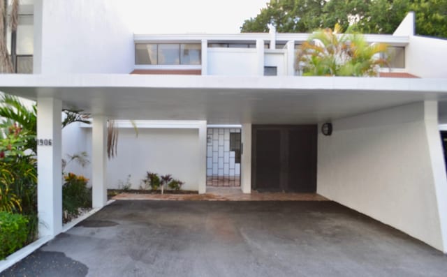 exterior space with a carport