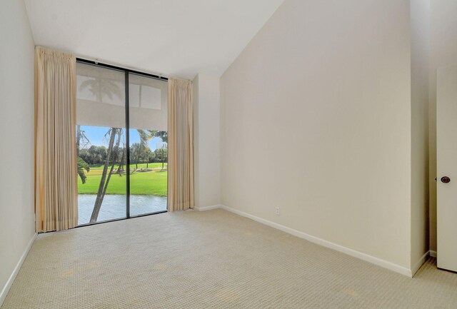 carpeted empty room with a water view