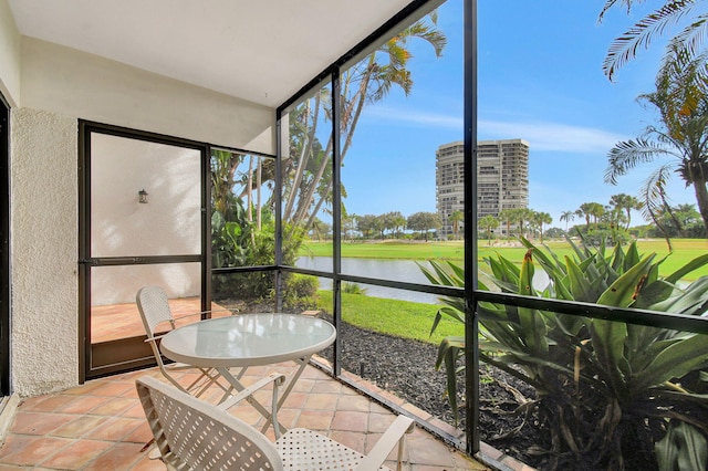 sunroom with a water view