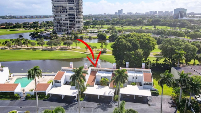 birds eye view of property with a water view