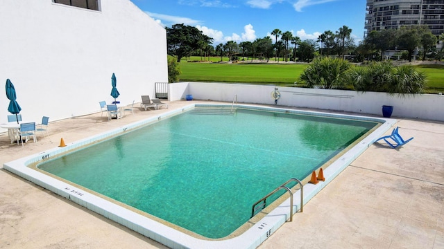 view of pool featuring a patio area