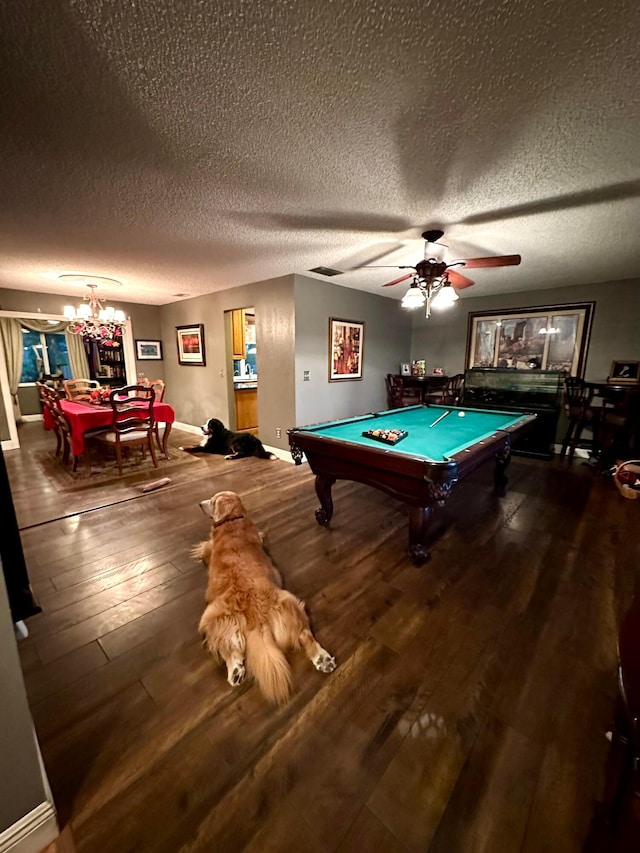 playroom with a textured ceiling, billiards, ceiling fan with notable chandelier, and dark wood-type flooring