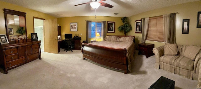 bedroom with light colored carpet, ceiling fan, and a textured ceiling