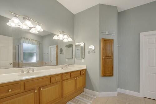 bathroom featuring vanity and tile patterned flooring