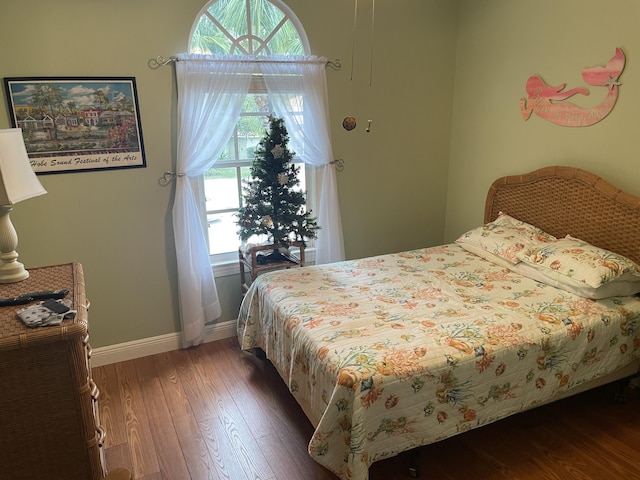 bedroom featuring dark wood-type flooring