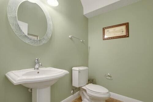 bathroom with toilet and sink