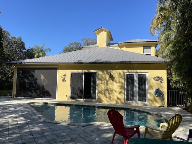 back of property featuring a patio area