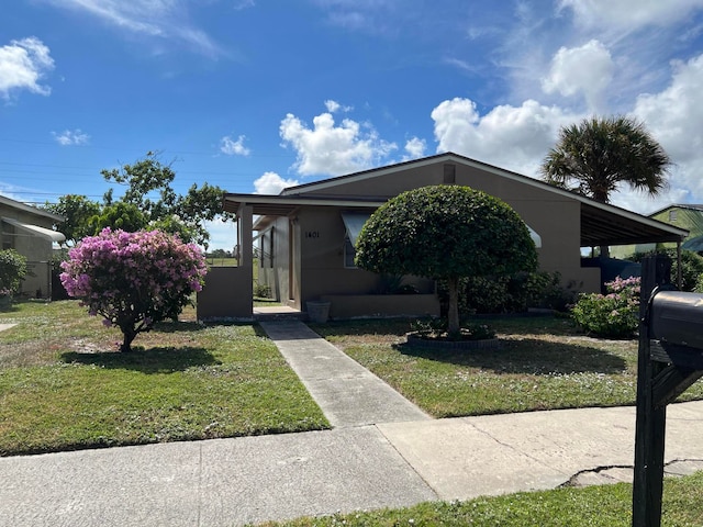 view of front of home with a front lawn