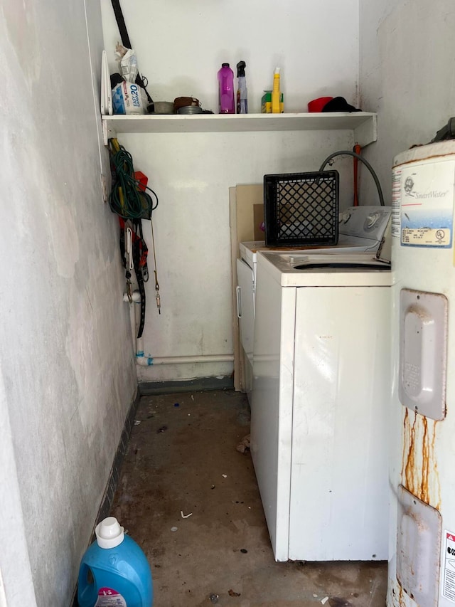 laundry area featuring water heater and independent washer and dryer