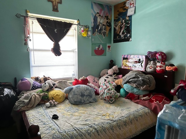 bedroom featuring multiple windows