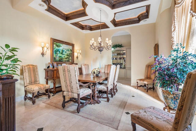 dining area featuring a towering ceiling, coffered ceiling, a notable chandelier, and beam ceiling