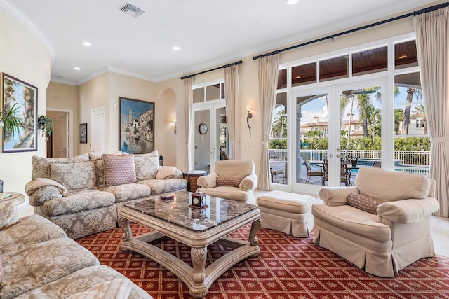 living room with french doors and crown molding