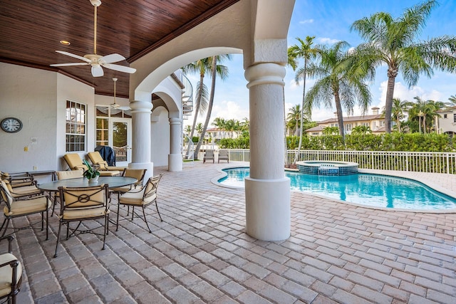 view of swimming pool featuring an in ground hot tub, a patio area, and ceiling fan