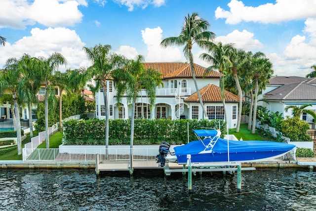 dock area featuring a balcony and a water view