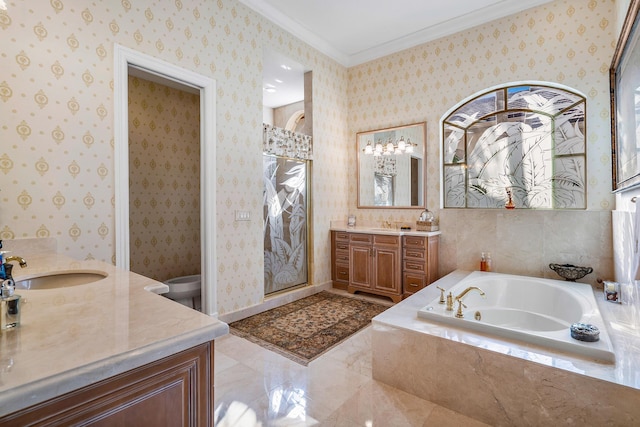 bathroom featuring crown molding, a relaxing tiled tub, and vanity