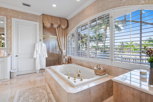 bathroom with ornamental molding, a wealth of natural light, vanity, and independent shower and bath