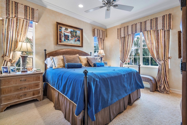 bedroom with ceiling fan, light colored carpet, and crown molding