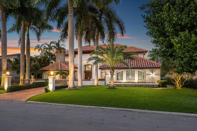 mediterranean / spanish-style house featuring a yard