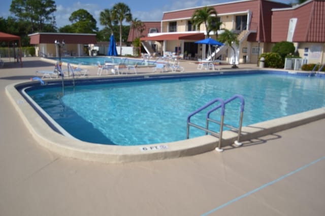 view of pool featuring a patio area