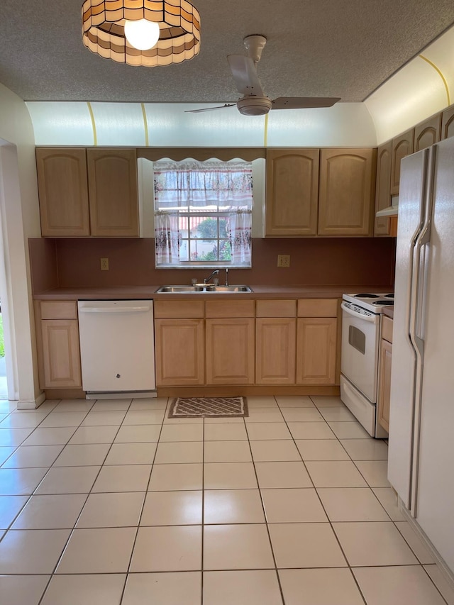 kitchen with white appliances, ceiling fan, sink, light brown cabinets, and a textured ceiling