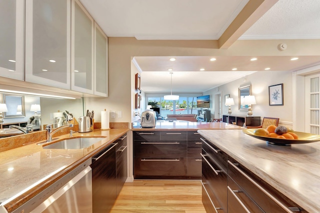 kitchen with crown molding, stainless steel dishwasher, light hardwood / wood-style floors, and sink