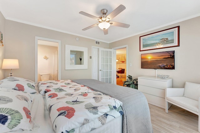 bedroom featuring crown molding, ceiling fan, and light wood-type flooring