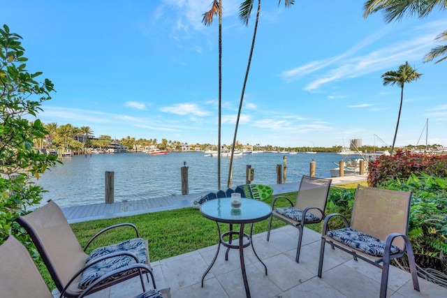 view of patio / terrace featuring a water view and a boat dock