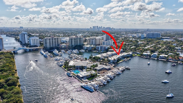 birds eye view of property with a water view