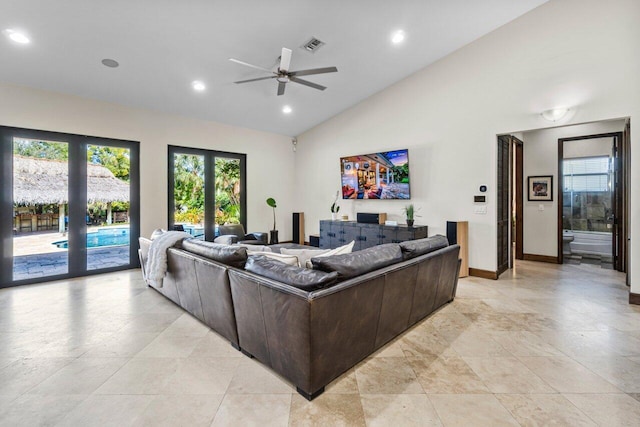 tiled living room featuring high vaulted ceiling, french doors, and ceiling fan