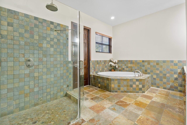 bathroom with shower with separate bathtub