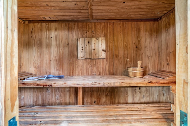 view of sauna / steam room featuring wood ceiling, wood walls, and hardwood / wood-style flooring