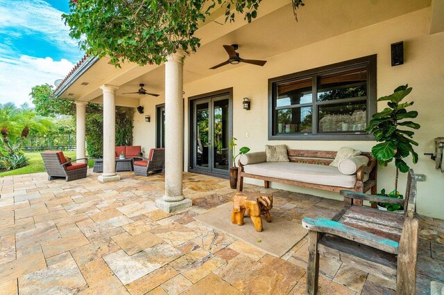 view of patio / terrace featuring an outdoor hangout area, ceiling fan, and french doors