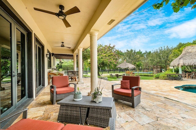 view of terrace featuring an outdoor hangout area and ceiling fan