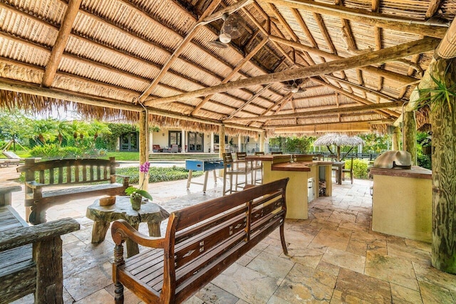 view of patio with area for grilling and a gazebo