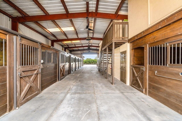 view of horse barn with an outdoor structure