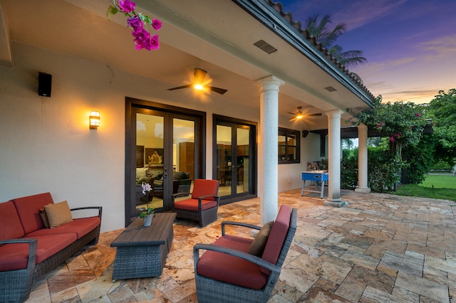 patio terrace at dusk with an outdoor hangout area